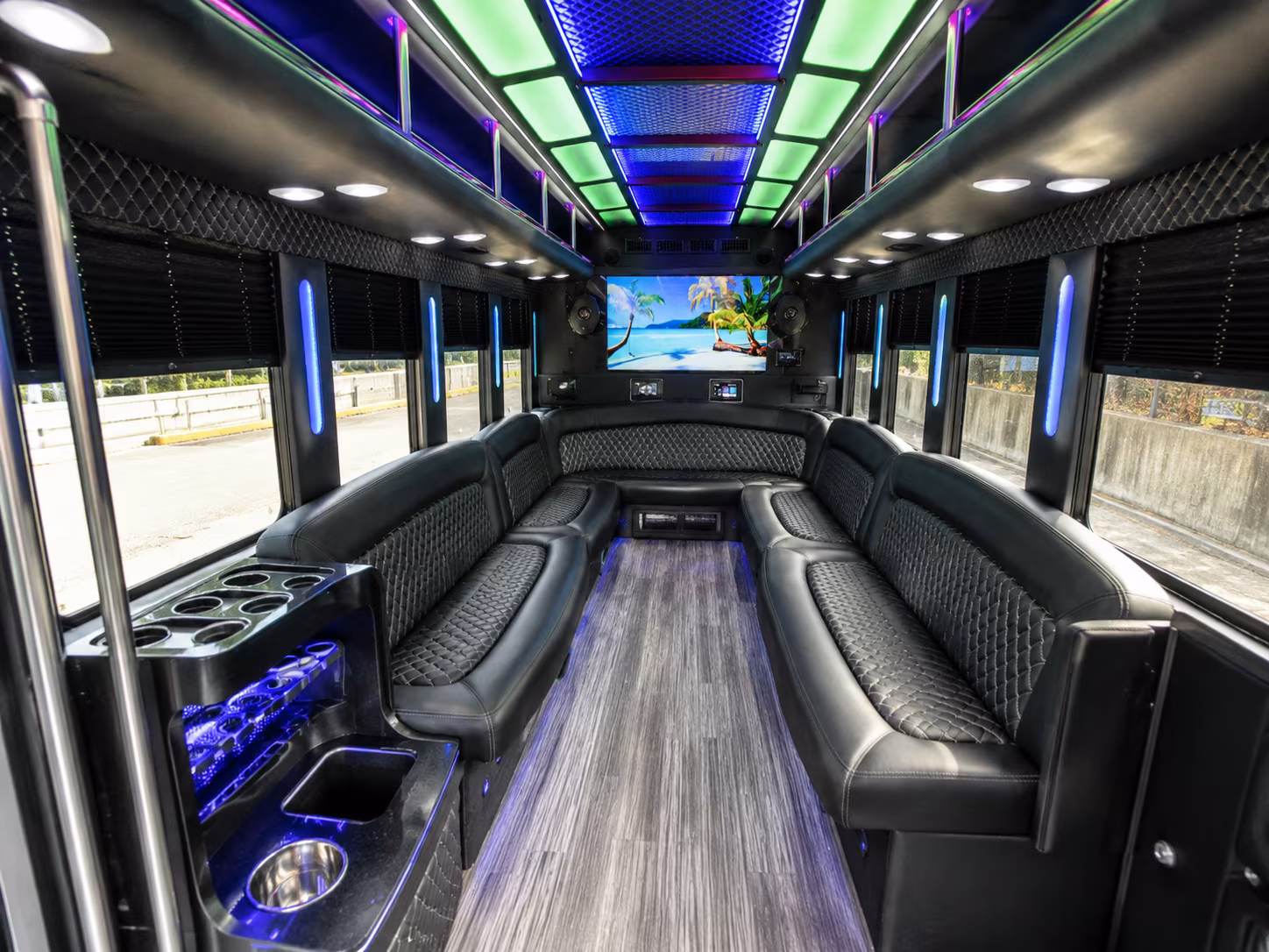 Friends laughing during a party bus celebration in Pittsburgh